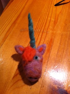 This is the emo unicorn... Inspired by a Halloween costume my mother made me when I was 5. I also felted in a magnet on the back so this guy lives on the fridge. 